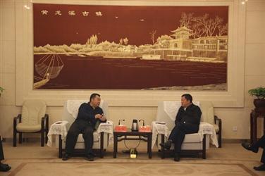 汤明拜会成都市双流区委书记周先毅